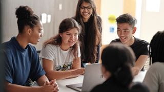 Students working together around a table