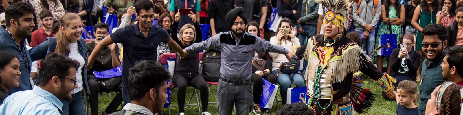 Group of people standing in a circle