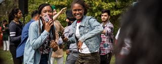 Two students smiling