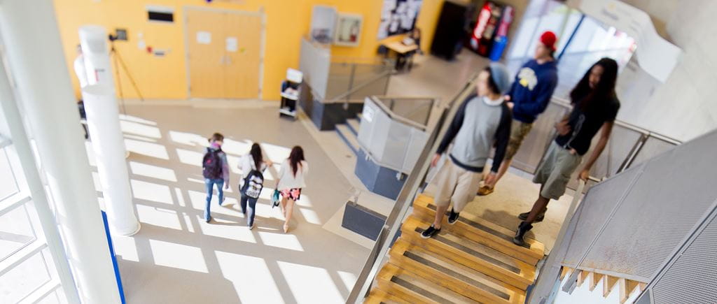 Students walking in the hallways at Trafalgar Campus