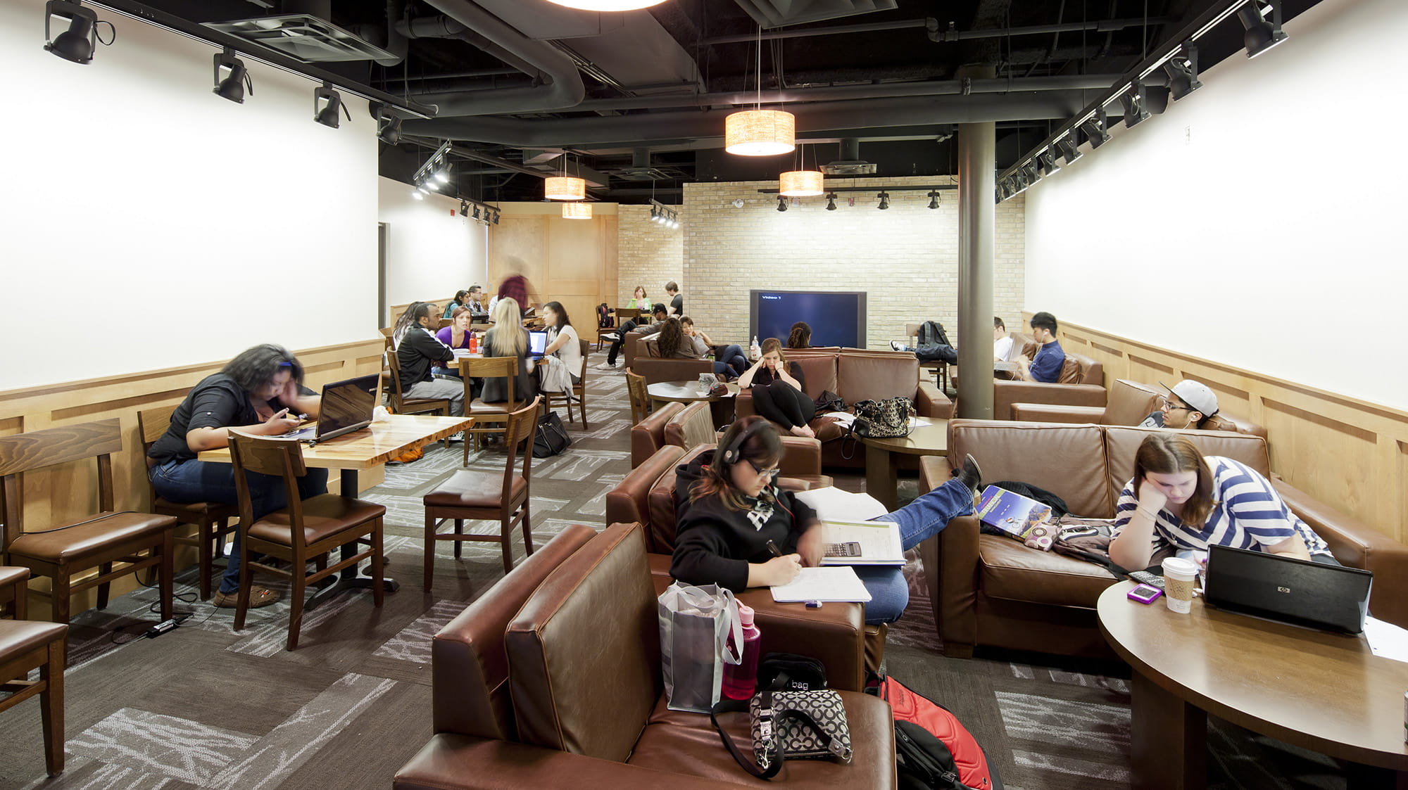 Students lounging and studying in the Bruin Coffee House at Sheridan's Davis Campus