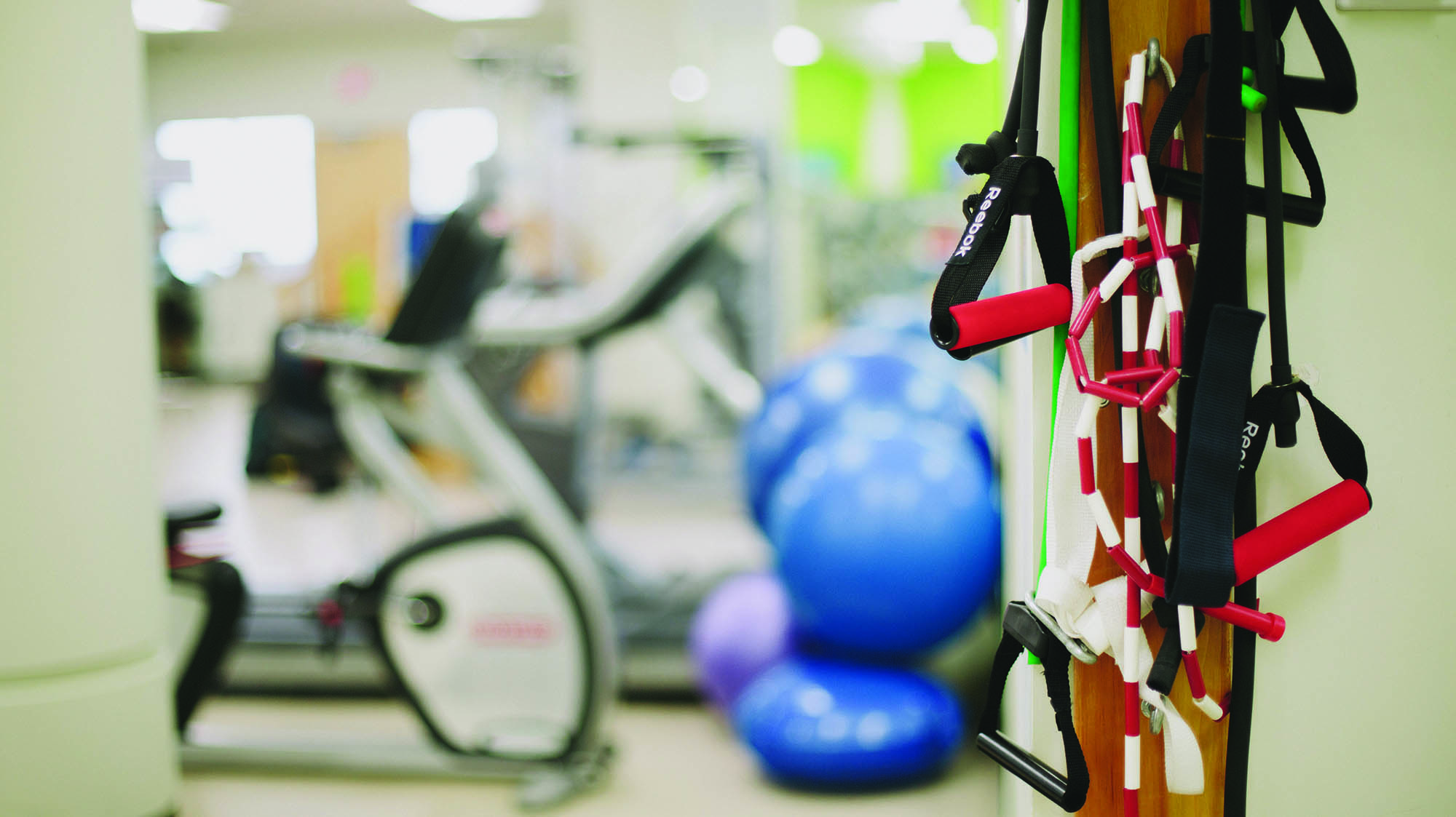 Some exercise balls, bikes and equipment at the Bruins Athletic Complex
