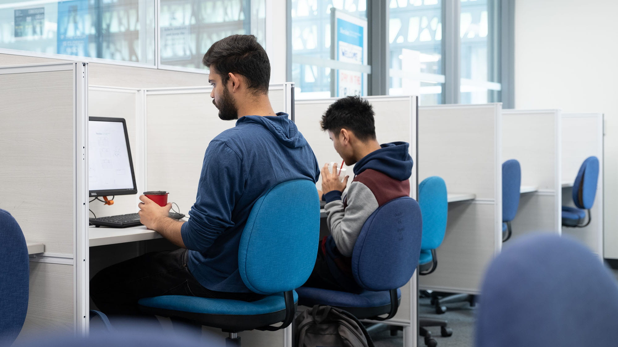 Students working at computer stations in the library