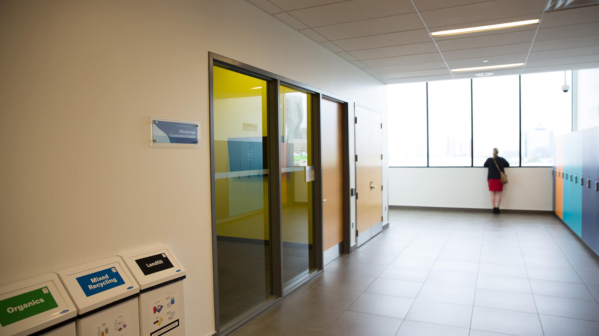 A bright hallway with sliding glass doors ouside a Group Study Room