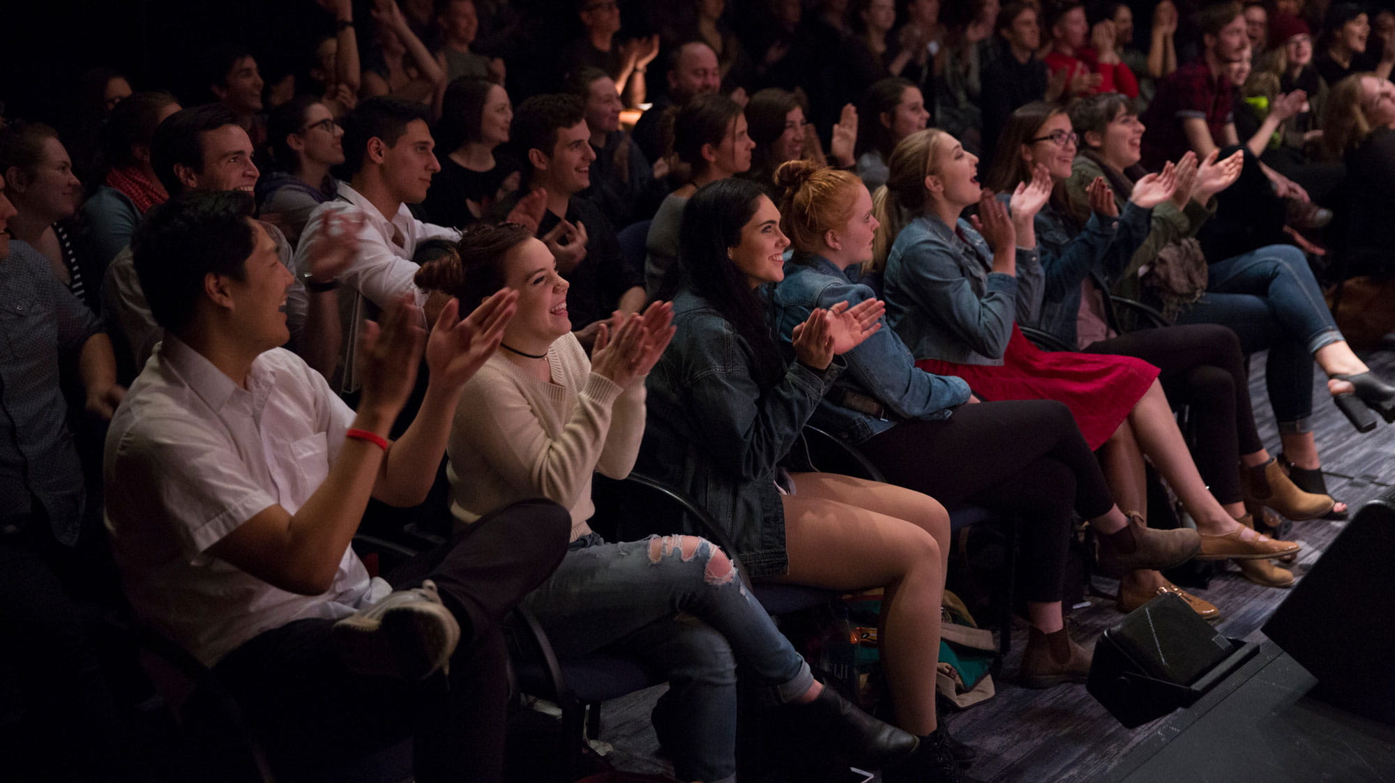 Theatre Sheridan audience applauding during a performance.