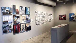 Various artworks hanging on the AA Gallery walls.