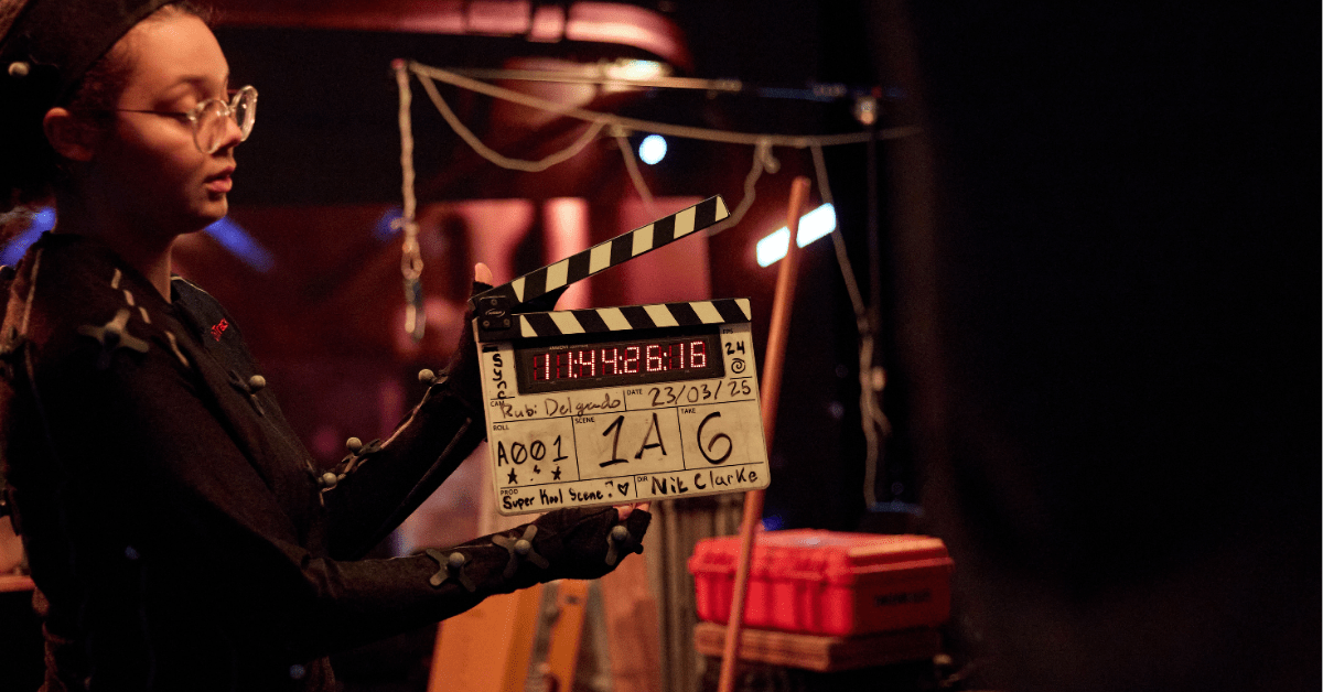 A person with a film clapper