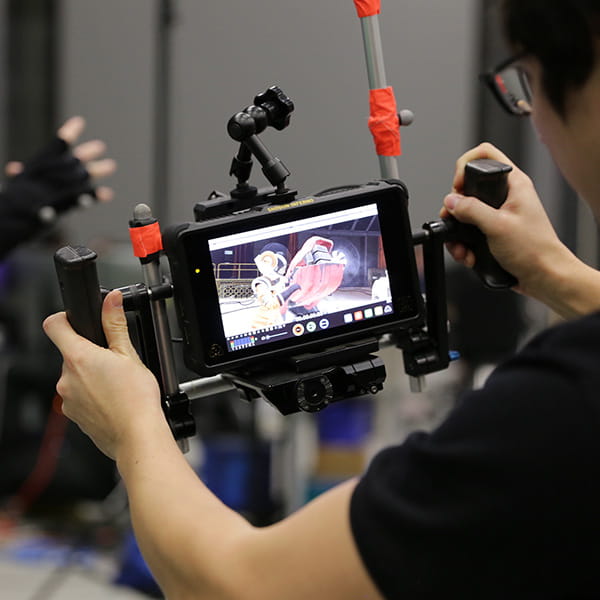 Person looking at a video display with animation on it