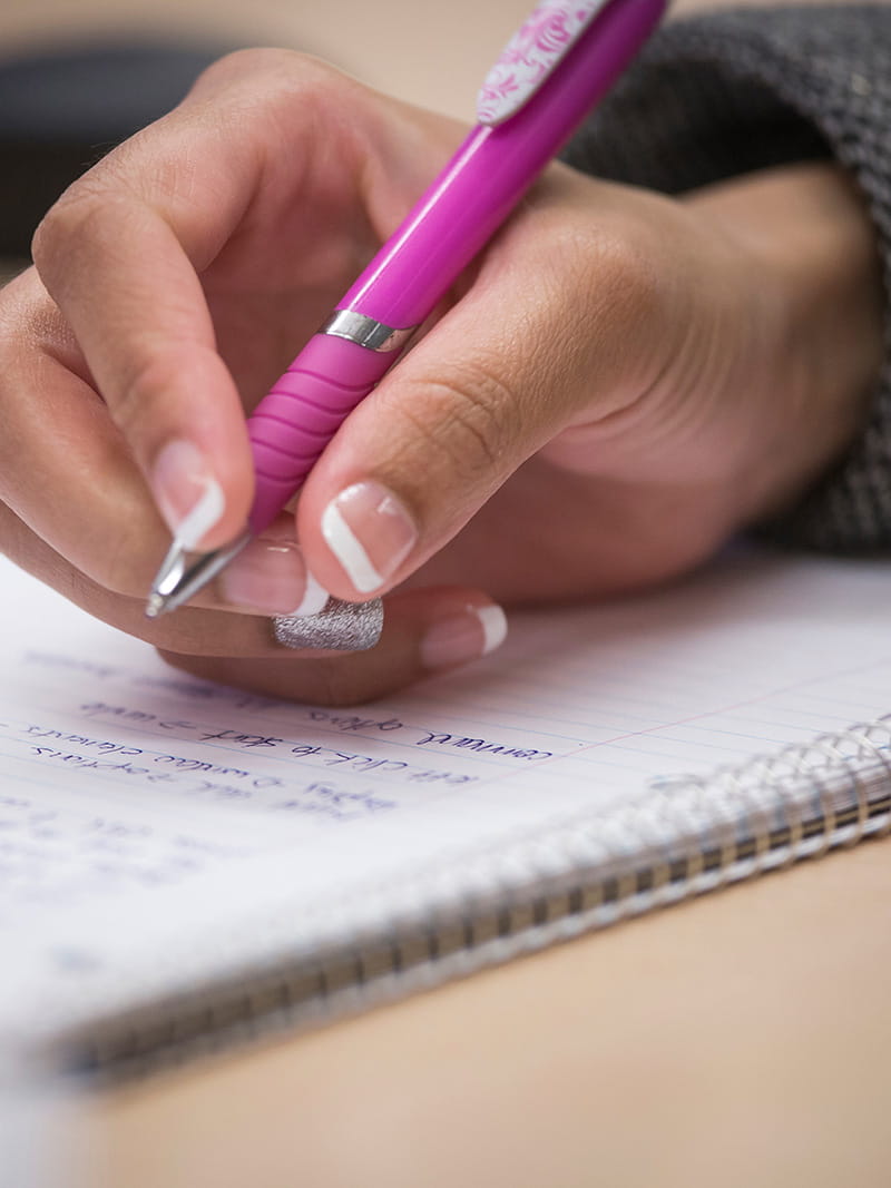 Hand writing on a notepad