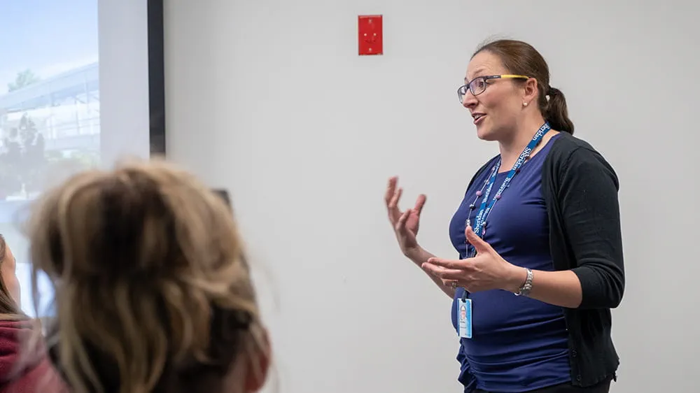 A Sheridan Recruitment representative delivering a presentation to a group of students