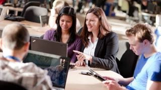 Sheridan College students working at a table