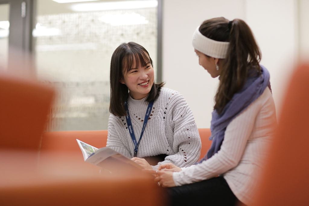 Two students in conversation