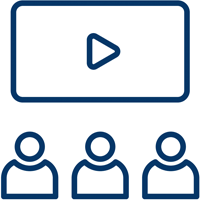 Three figures sitting opposite a video screen