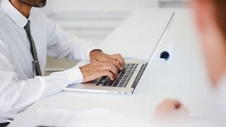 Person typing on a laptop