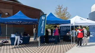Students visiting tents during student orientation at Trafalgar Road Campus