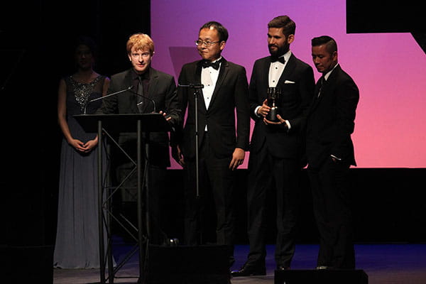 Alexander Poei and his team accepting their Annie Award
