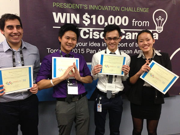 Students standing side-by-side and displaying their certificates
