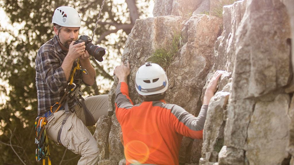Bielaski shooting camera images while climbing mountain