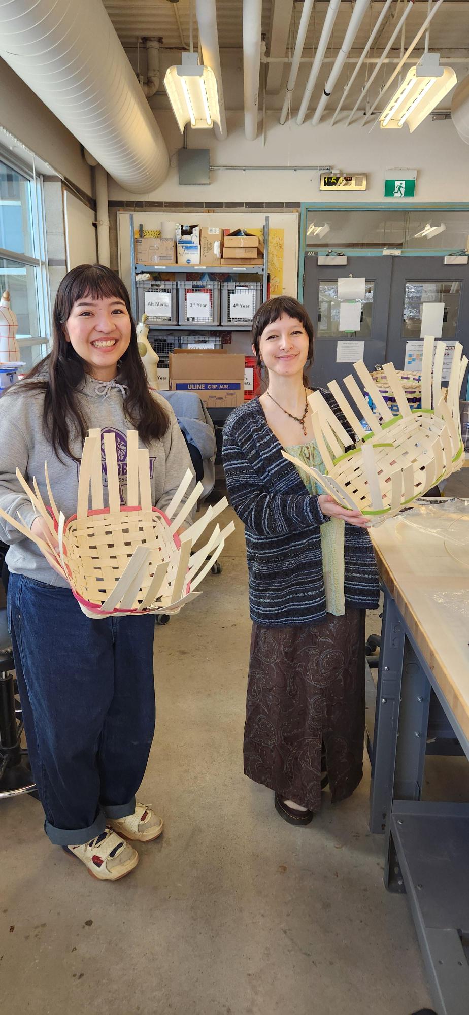 Kanerahtaien Doxtador-Swamp and a fellow student display the traditional Haudenosaunee baskets they created during a workshop offered by Sheridan's Centre for Indigenous Learning and Support