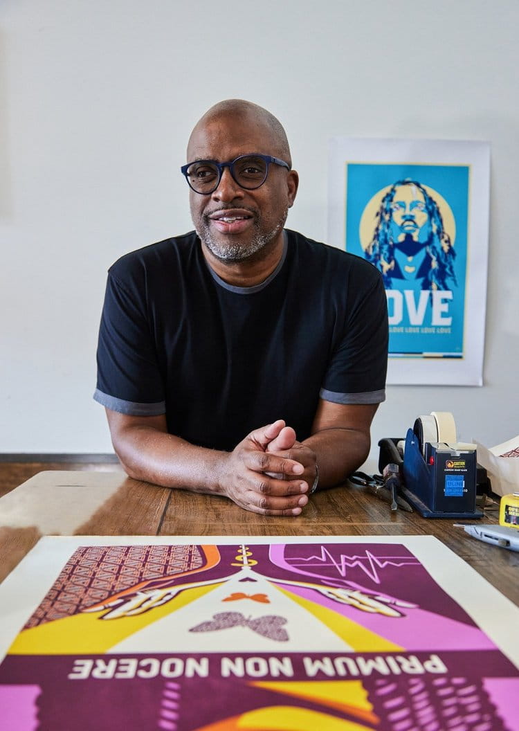 Robert Poulton is pictured with some of his design work.