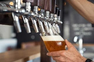 Pouring beer from stout
