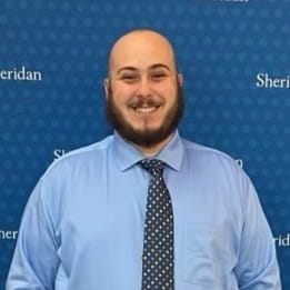 A head and shoulders portrait of Luigi Sposato