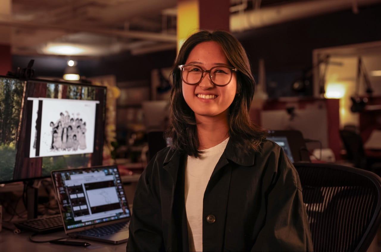 Sheridan Animation student Amelia Kim is pictured in front of a screen inside Walt Disney Animation Studios