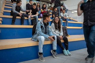 Two students engaged in a discussion
