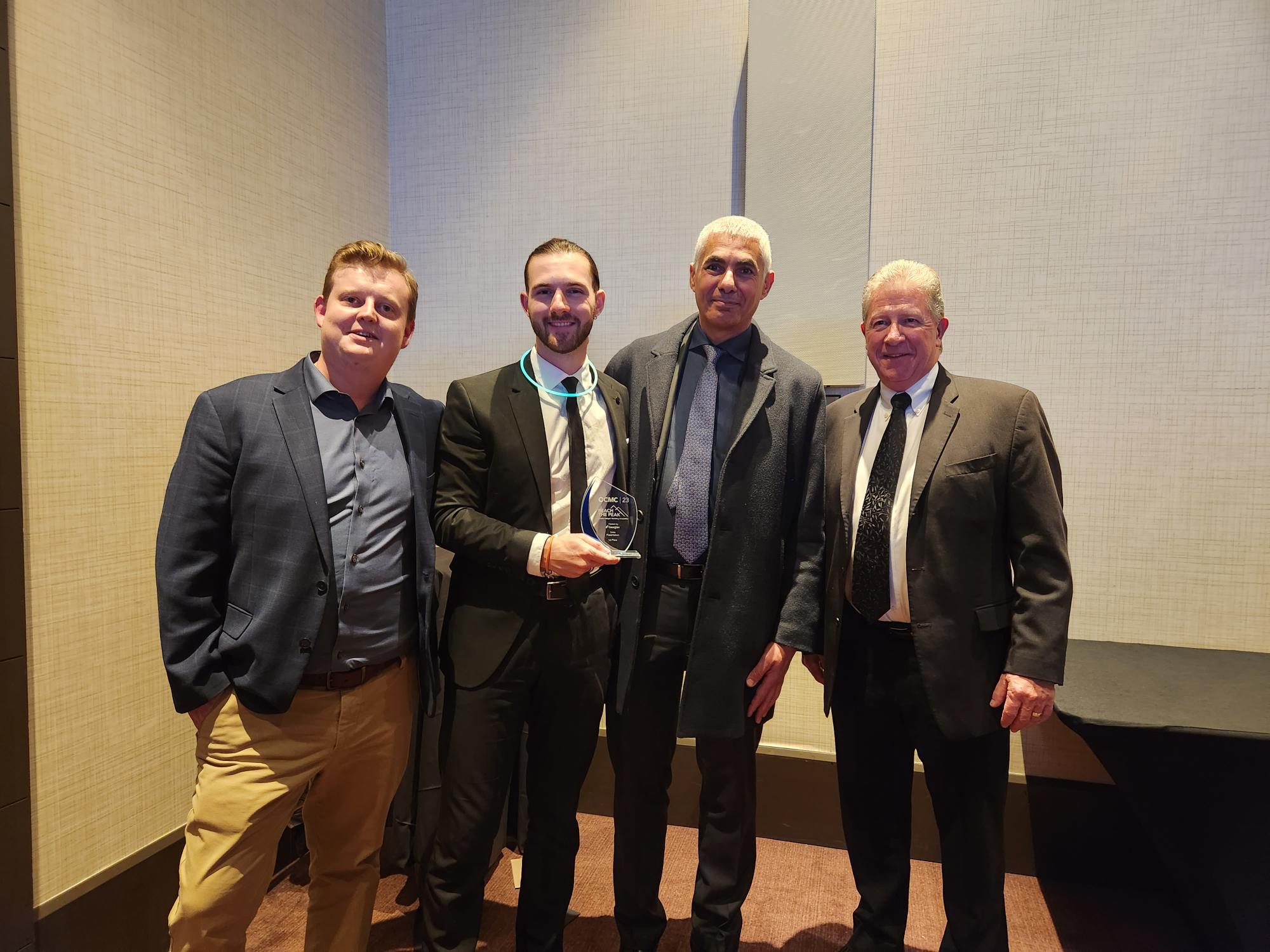 Pictured from left to right: Kade Kirkham (Bachelor of Business Administration - Marketing Management '23), John Monroe (second-year, Advertising and Marketing Communications), Muthana Souri, Dean, Pilon School of Business, and Keith Barnwell, Associate Dean, Pilon School of Business