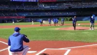 Omer throwing out first pitch