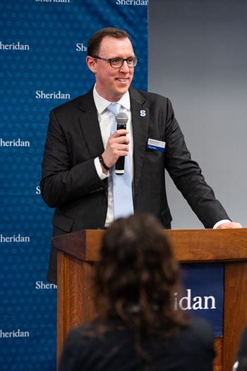 Sheridan Associate Vice-Provost, Academic and Industry Integrations Matt Rempel speaks at the podium