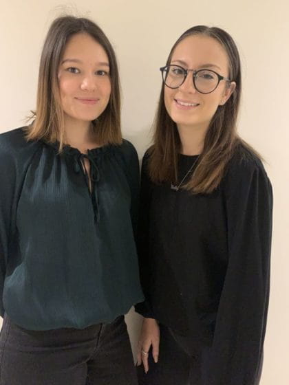 Two sisters standing