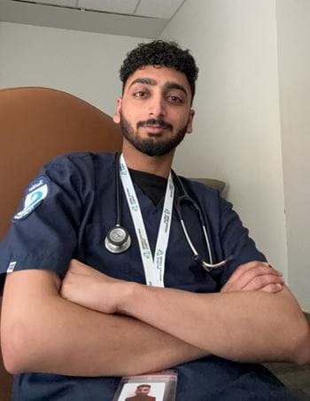 Shagundeep Singh wearing hospital scrubs