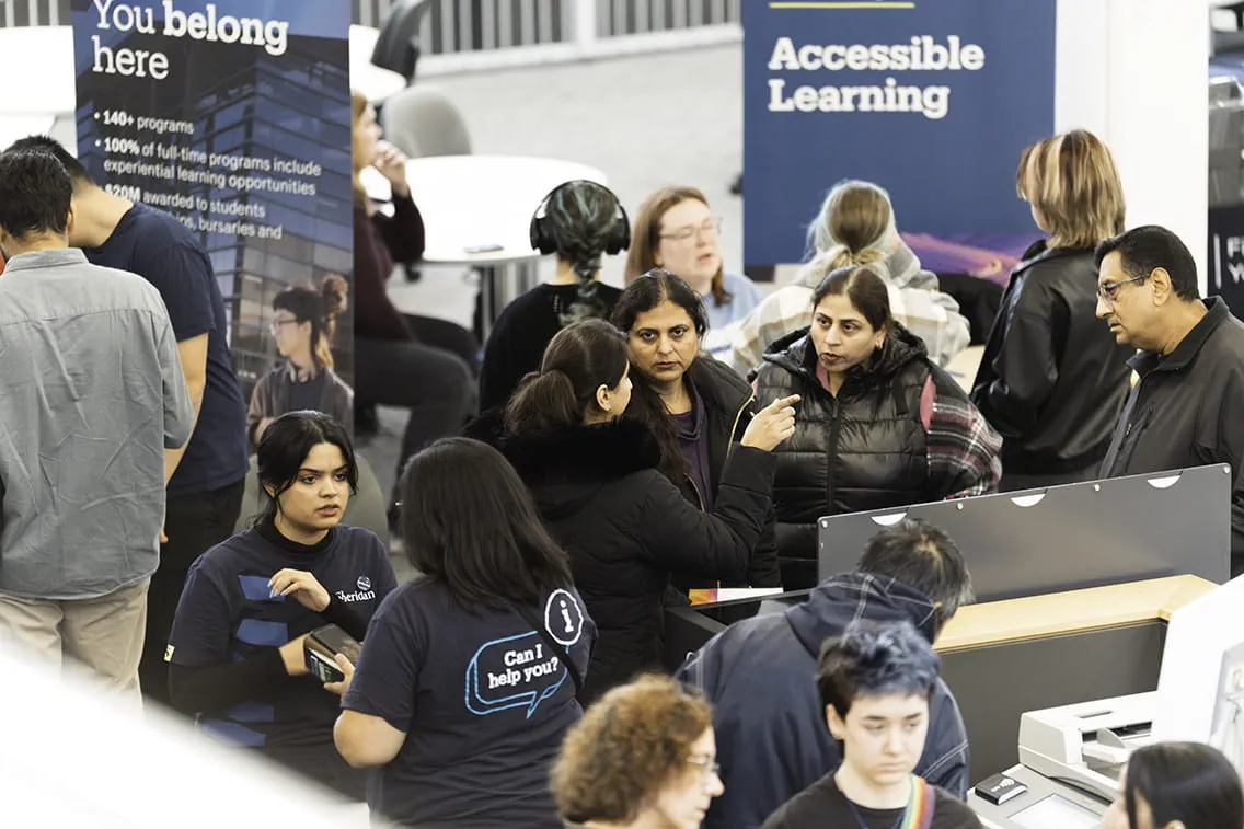 Future students and Sheridan faculty and staff gather in the Marketplace during Fall Open House