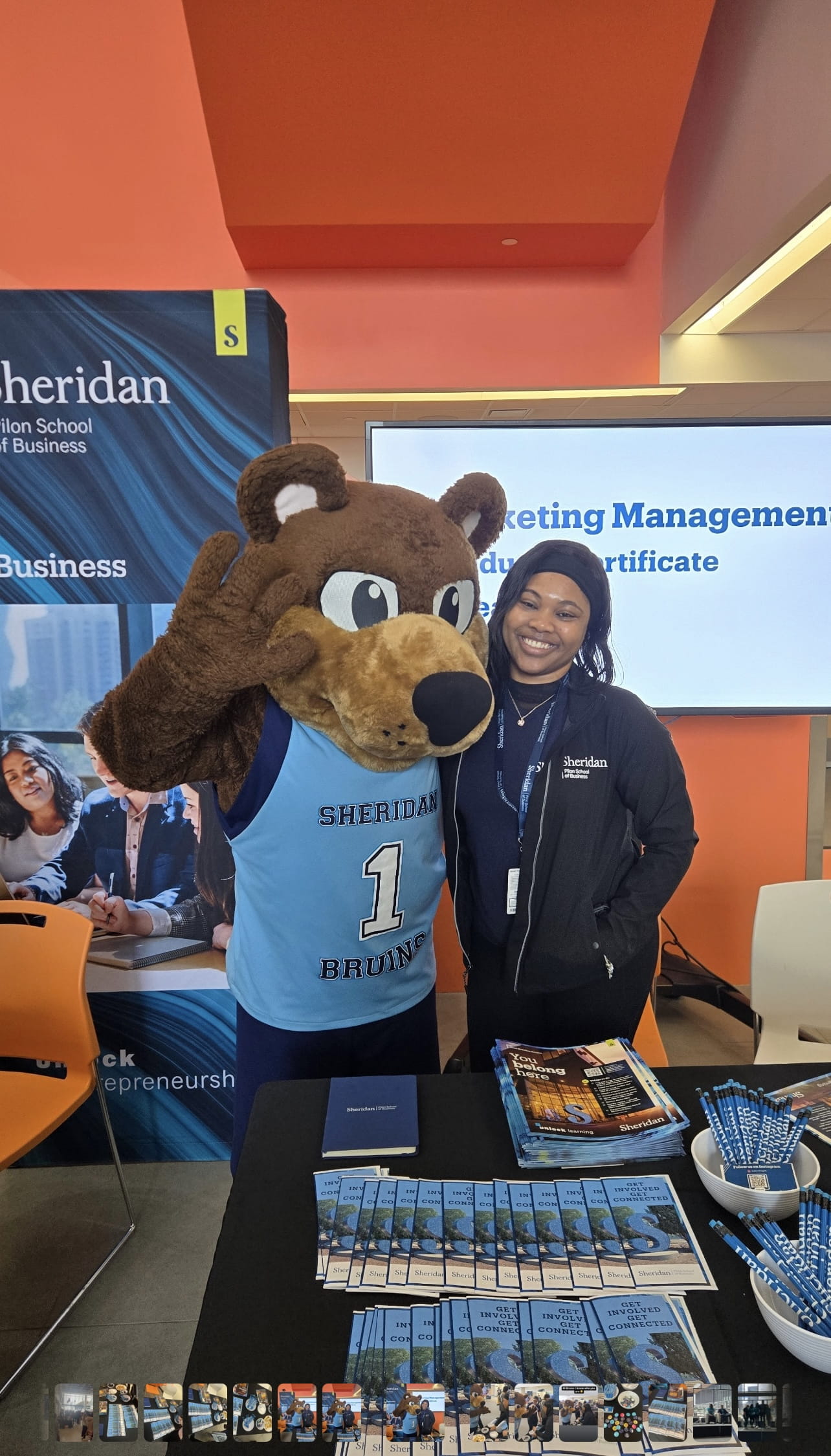 Rochell Samuels poses for a photo with Sheridan mascot Bruno