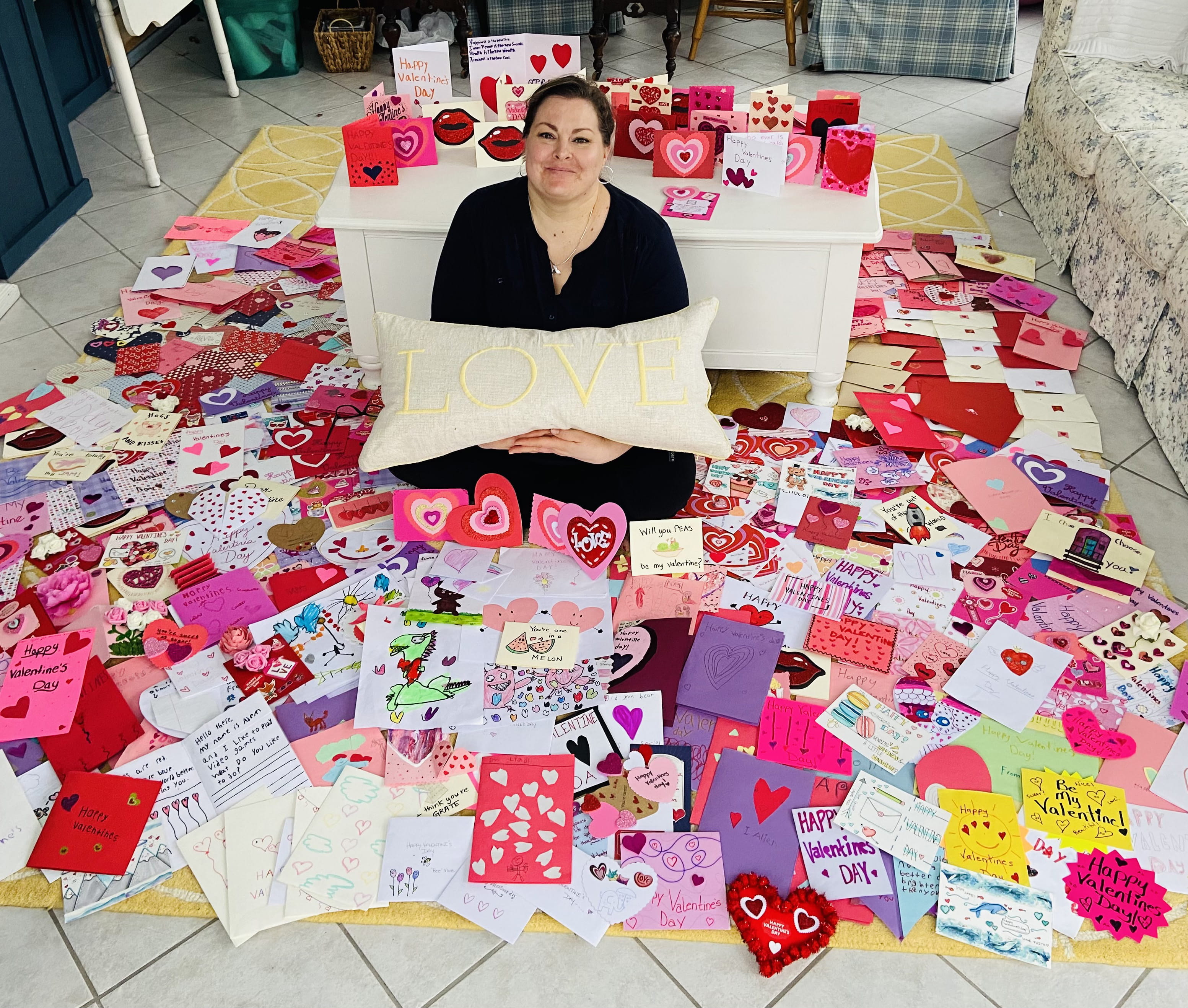 Amy Saccomano surrounded by hand-made Valentine's Day cards