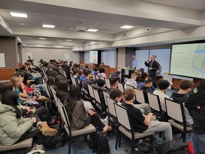 T.A. Blakelock high school students sit in the Sheridan Conference Centre listening to a presentation by Dr. Joel Lopata