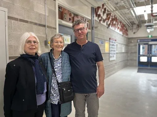 Anne Barros, Mary Corcoran and Gord Thompson standing side-by-side