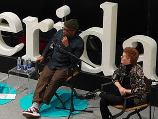 Jesse Jones and Dr. Cherie Werhun on stage for Chatter that Matters podcast event at Sheridan HMC.
