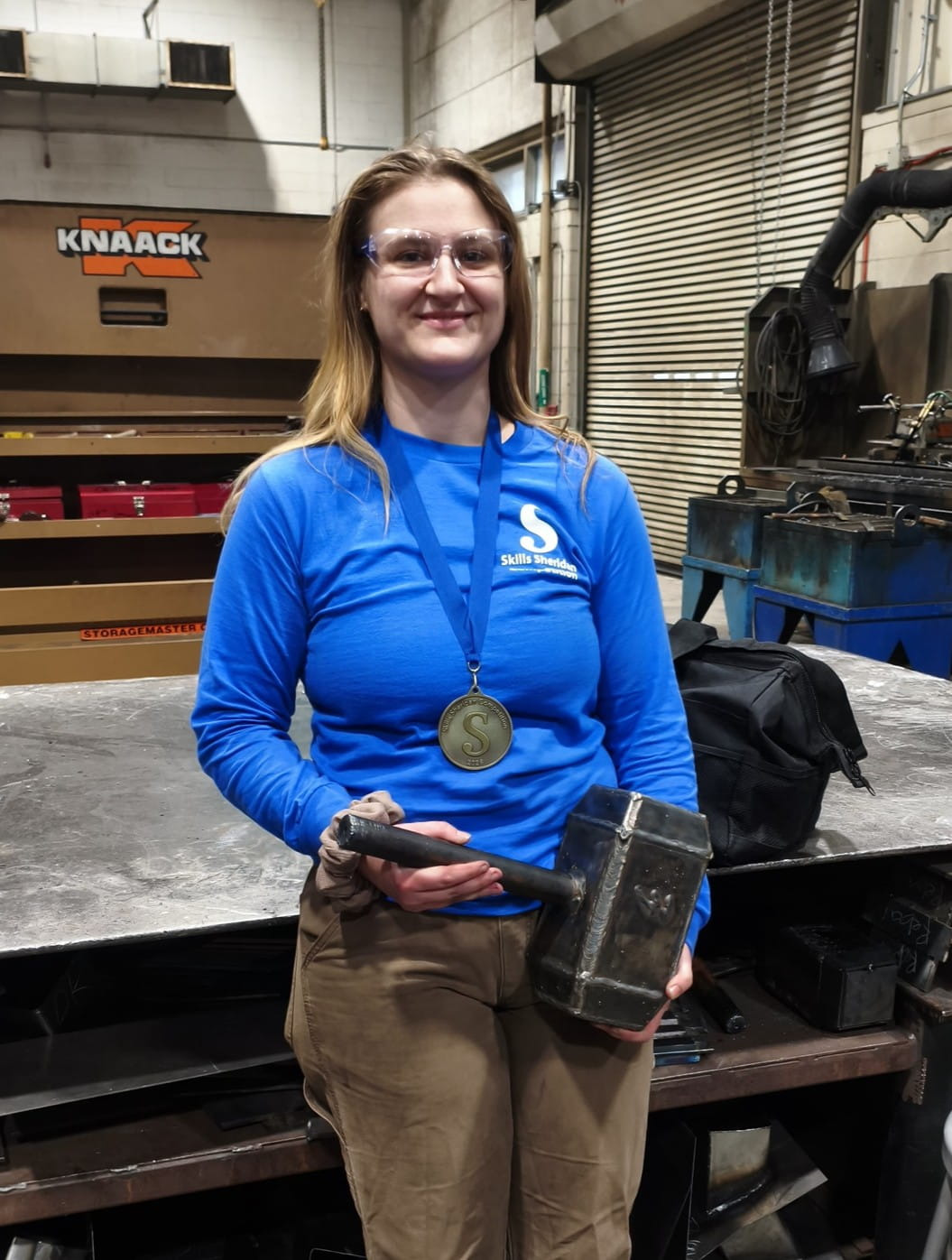 Valedictorian Gabriel Warren standing in the welding studio.