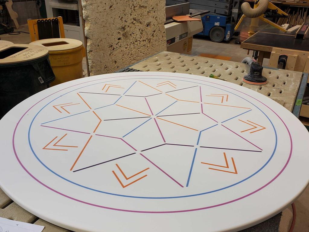 A table for the Indigenous Knowledge Centre that has a pattern of porcupine quill baskets