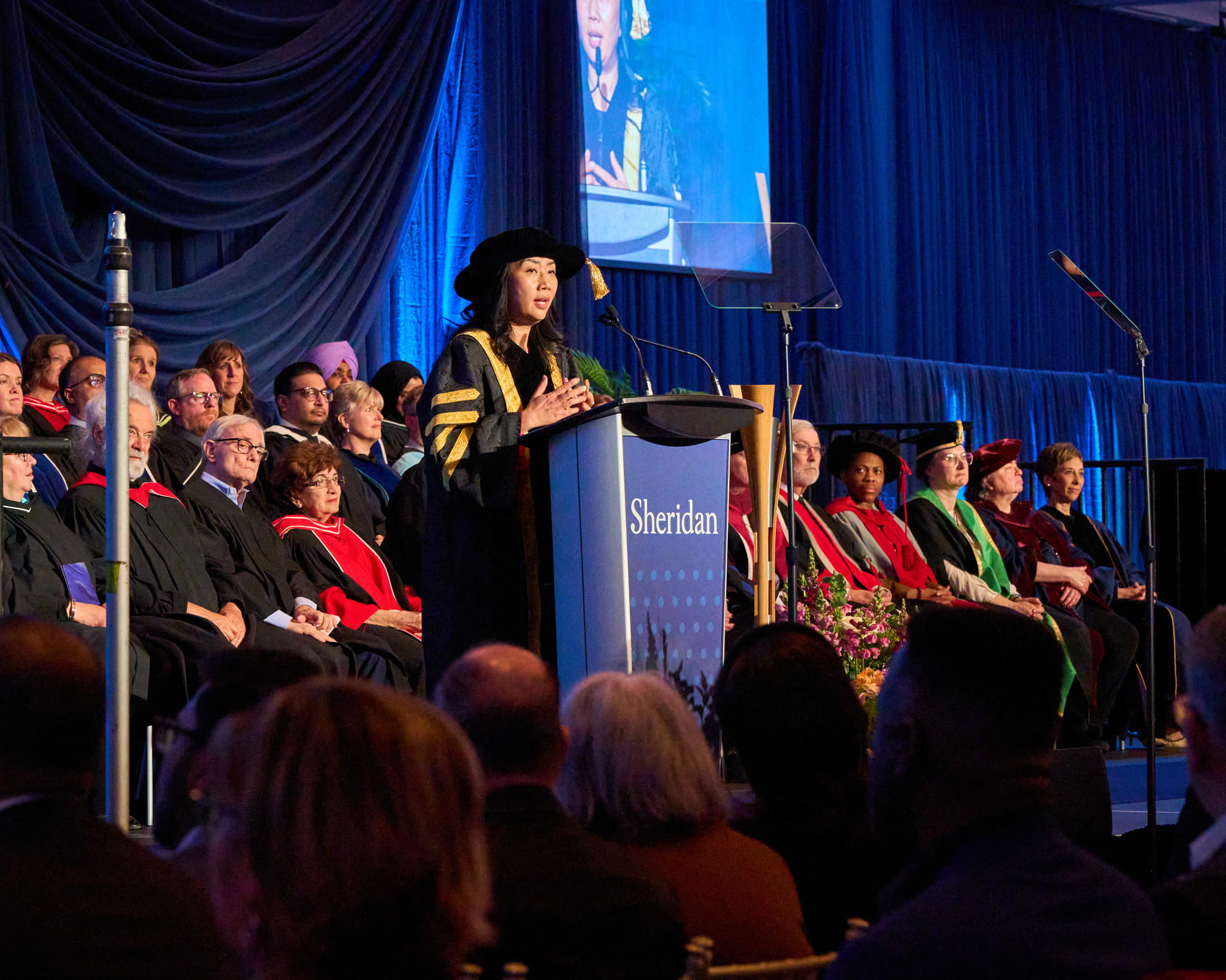 Dr. Cindy Gouveia delivers her remarks at the podium.
