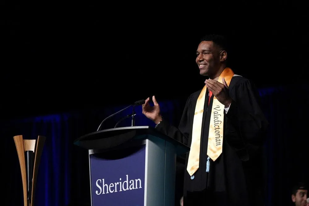 Valedictorian Jason-Tyler Edwards gives his speech at the Sheridan podium