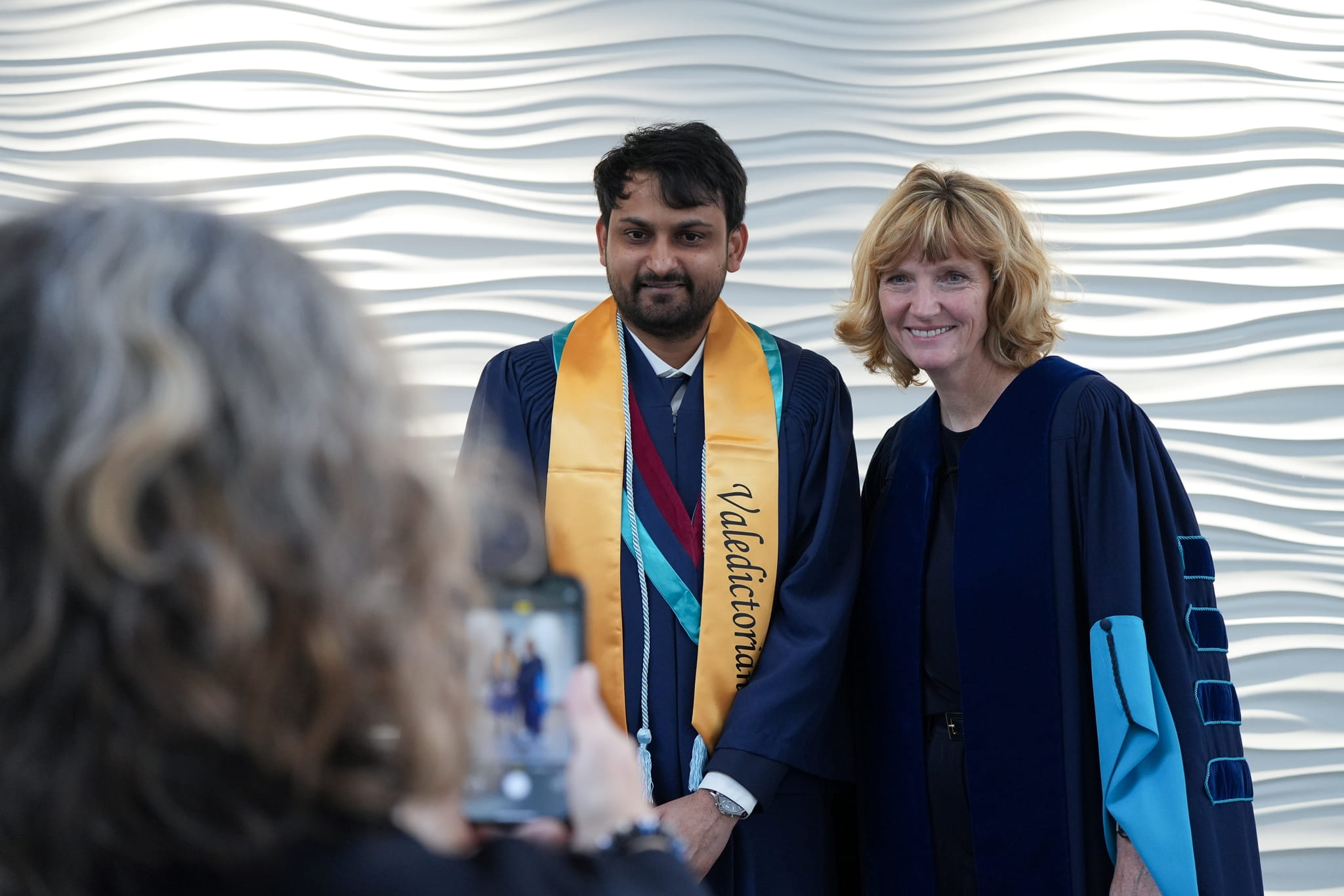 Valedictorian Mohit Motka with President Janet Morrison