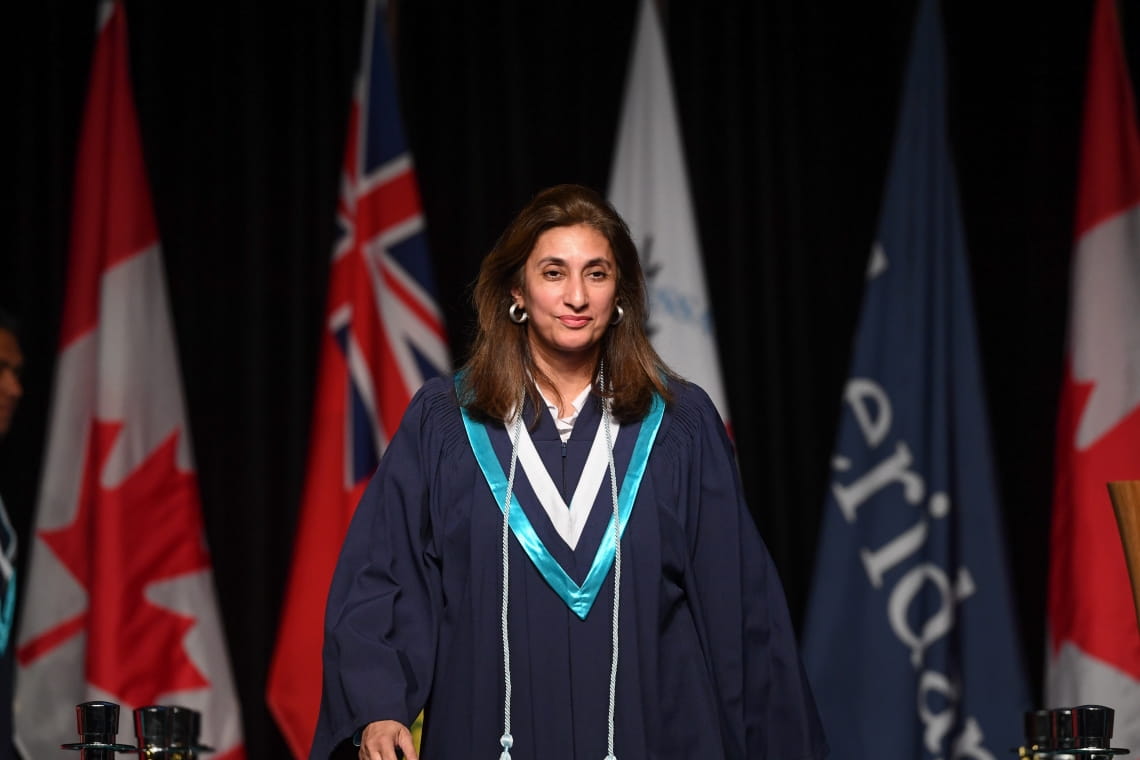 Nazia Murrad walks across the stage at convocation