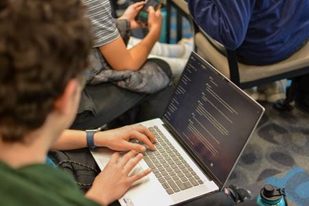 A picture of a laptop with ChatGPT prompts on it as students used the technology to simulate a conversation with an older adult