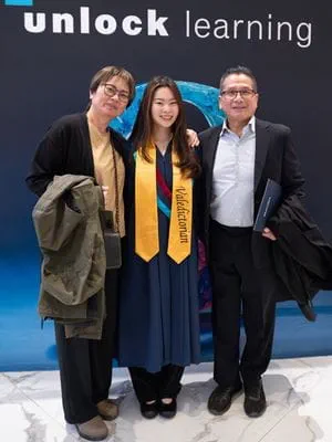 Valedictorian Aika Tsoi with her parents.