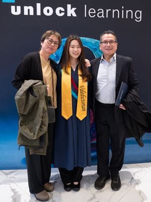 Valedictorian Aika Tsoi with her parents.