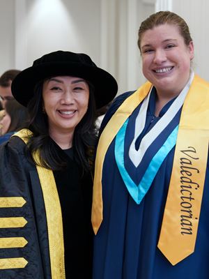 Sheridan president Cindy Gouveia poses with valedictorian Karina Bray.