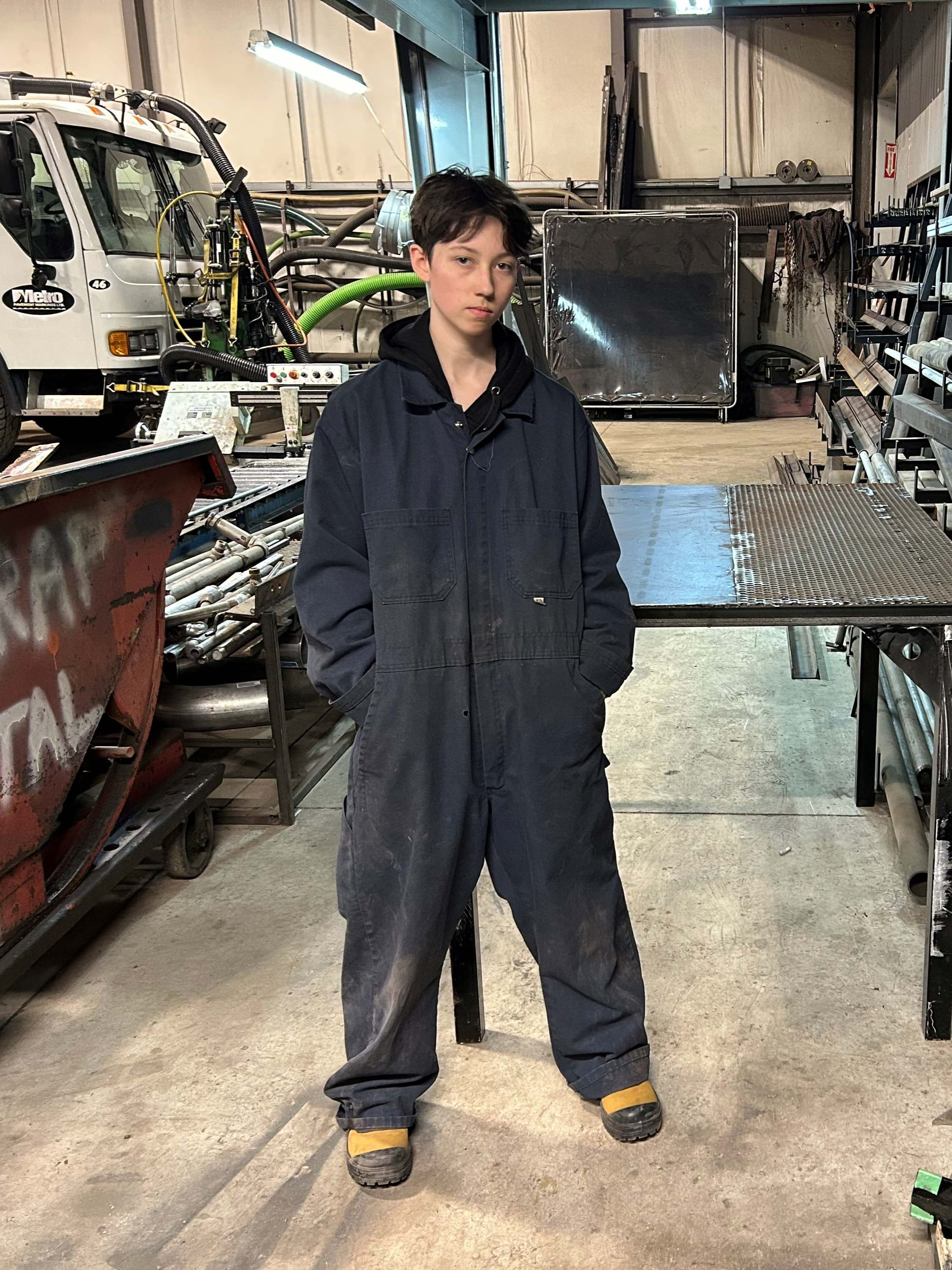 Valedictorian Mackenzie McPhee poses in the welding lab.